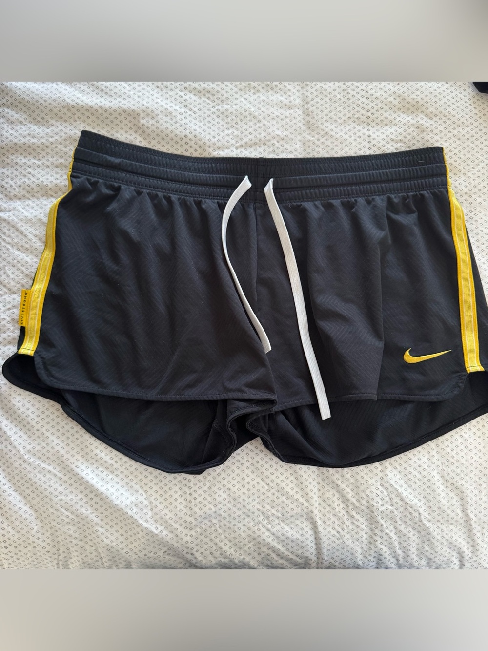 Nike Women's Black Athletic Shorts with Yellow Logo and White Drawstring